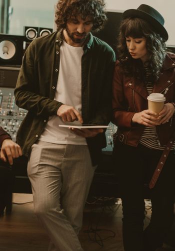 music band having conversation at sound recording studio